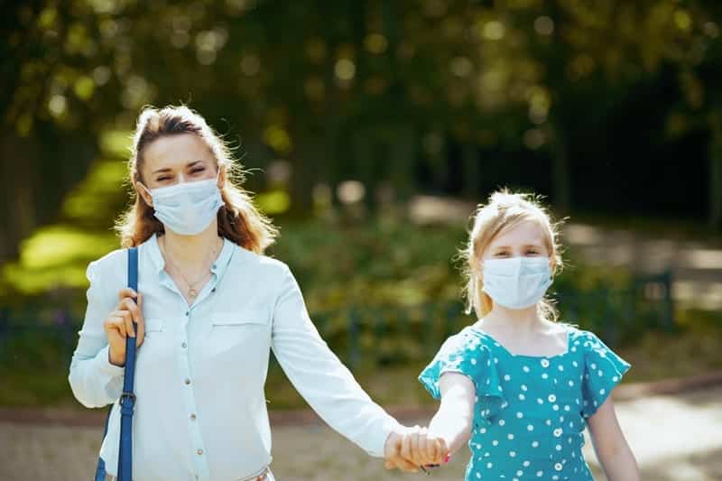 holding hands in masks